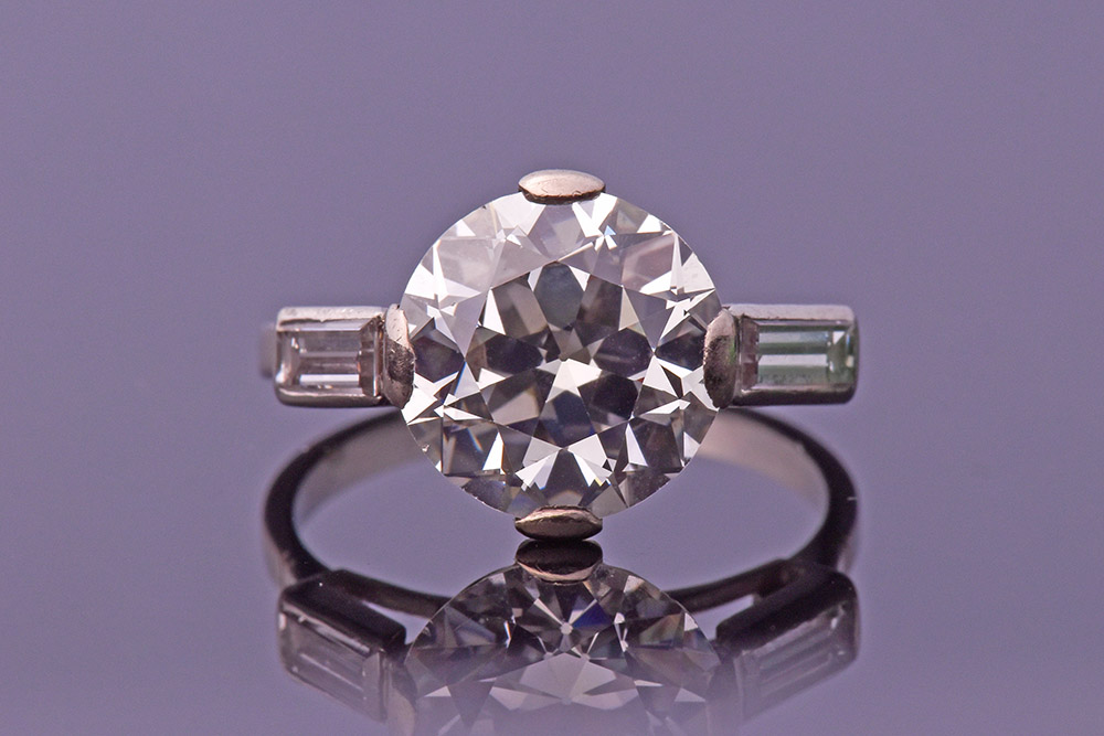 A large round brilliant-cut solitaire diamond ring of approximately 4.06 carats
